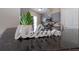 Granite kitchen counter with stainless appliances, neutral paint, and decorative plant at 8997 Lee Vista Blvd # 2009, Orlando, FL 32829