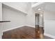 Open living room space featuring hardwood floors and a view of the second story loft at 8997 Lee Vista Blvd # 2009, Orlando, FL 32829