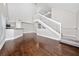 Inviting living room with open layout, hardwood flooring, and staircase to the second floor at 8997 Lee Vista Blvd # 2009, Orlando, FL 32829
