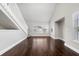 Inviting living room with open layout, hardwood flooring, neutral walls, and large windows at 8997 Lee Vista Blvd # 2009, Orlando, FL 32829
