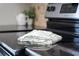 Cooktop on smooth black range top with a cloth resting on the glass at 8997 Lee Vista Blvd # 2009, Orlando, FL 32829