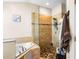 Stylish bathroom with a soaking tub, walk-in shower, and pebble stone flooring at 901 Cornell Ave, Clermont, FL 34711