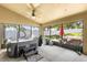 Enclosed patio with hot tub, grill, and outdoor furniture for entertaining at 901 Cornell Ave, Clermont, FL 34711