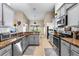 Modern kitchen featuring stainless steel appliances, granite countertops and eat-in breakfast area at 901 Cornell Ave, Clermont, FL 34711
