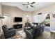 Comfortable living room offers a fireplace, wood flooring, and comfortable furniture at 901 Cornell Ave, Clermont, FL 34711
