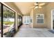 Enclosed patio with a view of the lawn and access to the interior at 901 Cornell Ave, Clermont, FL 34711
