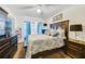 Comfortable bedroom with ceiling fan, curtains, television and a large dresser at 9231 Ventana Ln, Orlando, FL 32825