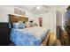 Bright bedroom offering a ceiling fan, artwork, and large dresser at 9231 Ventana Ln, Orlando, FL 32825