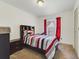 Comfortable bedroom featuring a bed with built-in shelves, providing a cozy retreat at 9231 Ventana Ln, Orlando, FL 32825