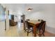 The dining room includes tile floors, a ceiling fan, and a breakfast bar in an open concept at 9231 Ventana Ln, Orlando, FL 32825