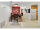Eat-in dining area features tile floors and a striking red accent wall with stylish decor at 9231 Ventana Ln, Orlando, FL 32825