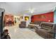 Spacious living room includes tiled floors, recessed lighting, and an open layout perfect for entertaining at 9231 Ventana Ln, Orlando, FL 32825
