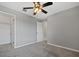 Bedroom with ceiling fan and open closet door at 9478 Silver Buttonwood St, Orlando, FL 32832