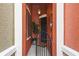 Welcoming front porch with decorative shutters, planter, and gated entry to the home at 9478 Silver Buttonwood St, Orlando, FL 32832