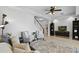 Bright living room featuring neutral walls, area rug, and staircase to the second floor at 9478 Silver Buttonwood St, Orlando, FL 32832
