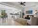 Open-concept space with living, kitchen, and dining areas that are perfect for entertaining at 9478 Silver Buttonwood St, Orlando, FL 32832