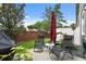 Inviting outdoor patio with comfortable seating, a grill, and lush greenery at 9478 Silver Buttonwood St, Orlando, FL 32832
