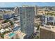 Elevated aerial shot of high-rise condo building featuring city views and rooftop pool at 150 E Robinson St # 2506, Orlando, FL 32801