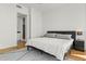 Serene bedroom with minimalist decor, neutral tones, and hardwood flooring throughout at 150 E Robinson St # 2506, Orlando, FL 32801