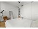 Well-lit bedroom with large windows, ample closet space and modern chair and lighting at 150 E Robinson St # 2506, Orlando, FL 32801