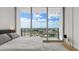 Bright bedroom boasts expansive windows with stunning city views and natural light at 150 E Robinson St # 2506, Orlando, FL 32801