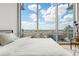 Enjoy city views from this bedroom with large windows, wood floors and neutral decor at 150 E Robinson St # 2506, Orlando, FL 32801