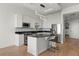 Updated kitchen features stainless steel appliances, a breakfast bar, and a tile backsplash at 150 E Robinson St # 2506, Orlando, FL 32801