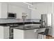 Modern kitchen with stainless steel appliances, dark counters, and white cabinetry at 150 E Robinson St # 2506, Orlando, FL 32801