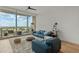 Open living room features a neutral rug, hardwood floors and a balcony with spectacular city views at 150 E Robinson St # 2506, Orlando, FL 32801