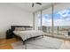 Main bedroom with floor to ceiling windows and neutral tones, wood floors, and modern decor at 150 E Robinson St # 2506, Orlando, FL 32801