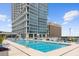 Relaxing rooftop pool with lounge chairs and city views at 150 E Robinson St # 2506, Orlando, FL 32801