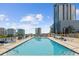 Stunning rooftop pool offering luxurious lounging and city views with nearby high rise buildings at 150 E Robinson St # 2506, Orlando, FL 32801