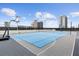 Vibrant blue sport court for tennis and basketball games with an amazing cityscape backdrop at 150 E Robinson St # 2506, Orlando, FL 32801