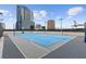 Outdoor sport court perfect for basketball and tennis featuring tall buildings behind the court at 150 E Robinson St # 2506, Orlando, FL 32801