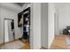 Organized walk-in closet with custom shelving and a full-length mirror at 150 E Robinson St # 2506, Orlando, FL 32801