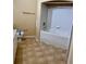 Well-lit bathroom featuring tile flooring, a toilet, and a tiled shower-tub combo at 107 Vista Verdi Cir # 121, Lake Mary, FL 32746
