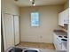 Bright kitchen with white appliances, cabinets, and laminate flooring at 107 Vista Verdi Cir # 121, Lake Mary, FL 32746