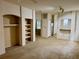 Inviting living area with carpet, neutral walls, and built-in shelving units at 107 Vista Verdi Cir # 121, Lake Mary, FL 32746