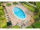 Community pool featuring lounge chairs, cabanas, and lush landscaping at 107 Vista Verdi Cir # 121, Lake Mary, FL 32746