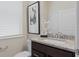 This bathroom boasts granite counters, modern fixtures, and a neutral palette at 15980 Cape Coral Loop, Clermont, FL 34714