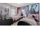 Stylish bedroom with twin beds, guitar art, and modern black and white decor at 15980 Cape Coral Loop, Clermont, FL 34714