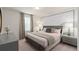 Comfortable bedroom featuring a plush bed, dual nightstands, and warm, neutral decor at 15980 Cape Coral Loop, Clermont, FL 34714