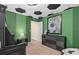 Unique soccer-themed bedroom design with a dark furniture set and sports artwork at 15980 Cape Coral Loop, Clermont, FL 34714