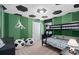 Fun bedroom with soccer-themed decor, a bunk bed, and unique ceiling design at 15980 Cape Coral Loop, Clermont, FL 34714