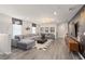 Open-concept living room with a large sectional sofa and movie-themed accents at 15980 Cape Coral Loop, Clermont, FL 34714