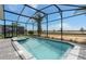 Relaxing pool and spa area, surrounded by a screened enclosure, offers a private outdoor retreat at 15980 Cape Coral Loop, Clermont, FL 34714