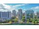 Aerial view showing the building near a lake, cityscape, and lush trees offering an ideal location at 322 E Central Blvd # 1008, Orlando, FL 32801