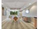 Bright dining area with a glass table, seating for ten, and a window offering views of the trees at 322 E Central Blvd # 1008, Orlando, FL 32801