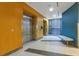 Elevators and waiting area with bench seating at 322 E Central Blvd # 1008, Orlando, FL 32801