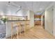 Kitchenette with breakfast bar and wood floors at 322 E Central Blvd # 1008, Orlando, FL 32801